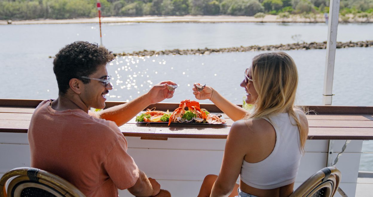 couple on cruise with seafood platter