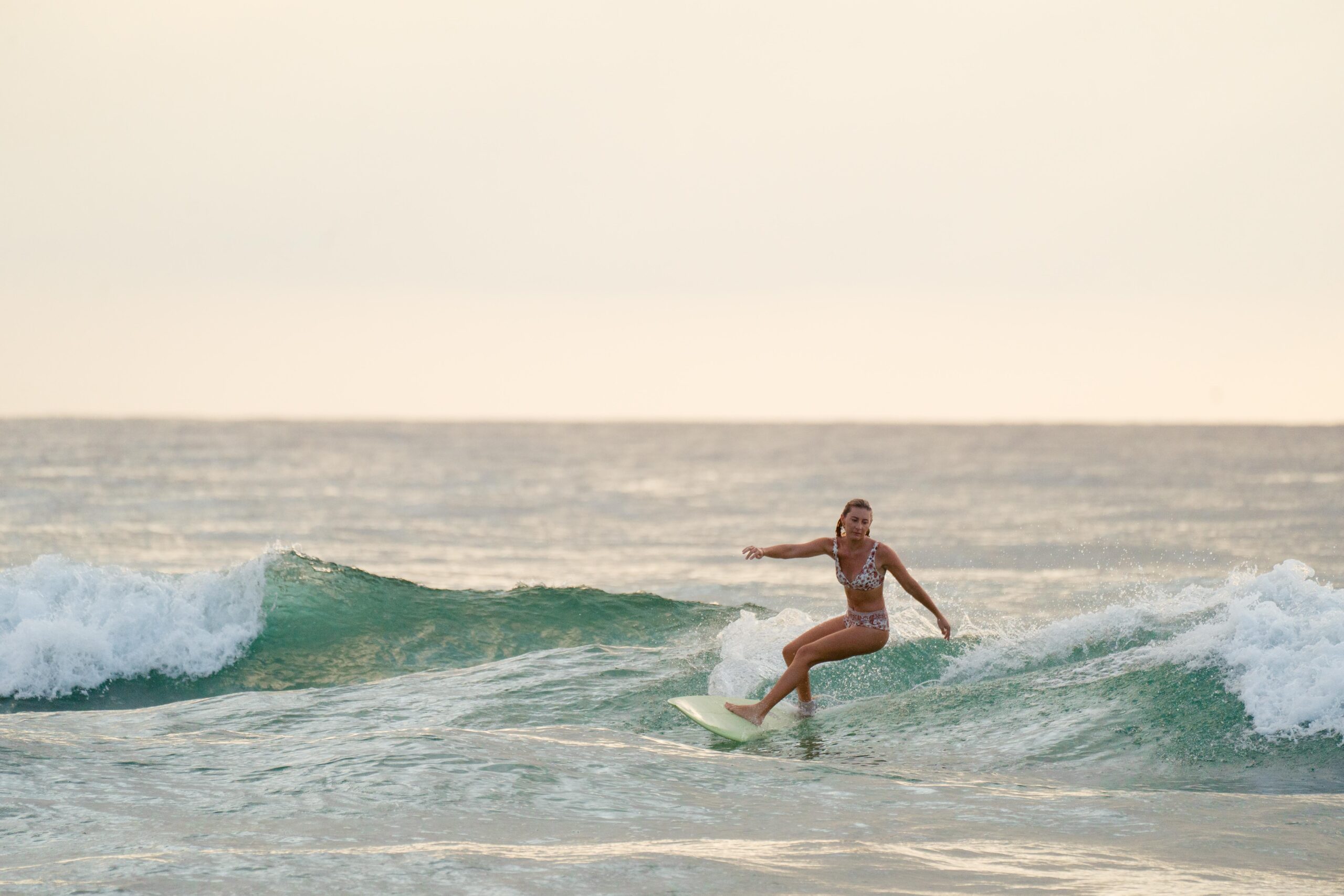 girl surfing at duranbah beach
