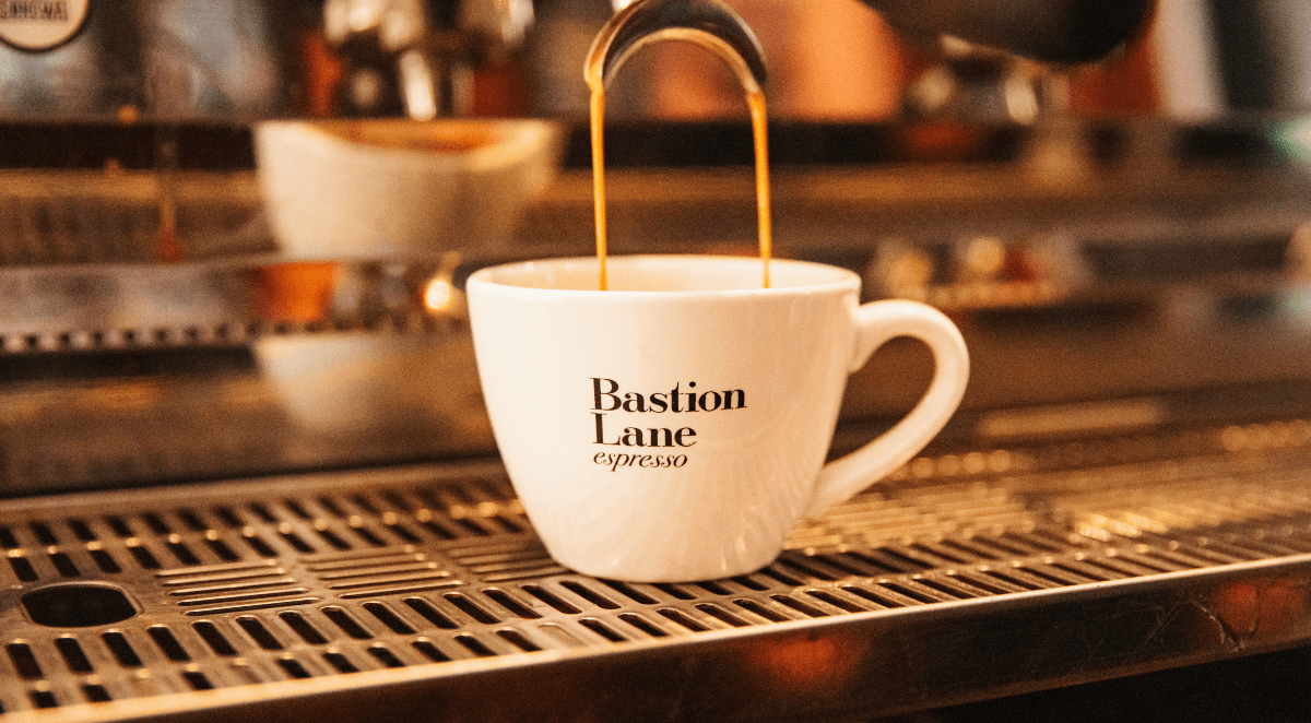 Coffee pouring into Bastion Lane coffee cup