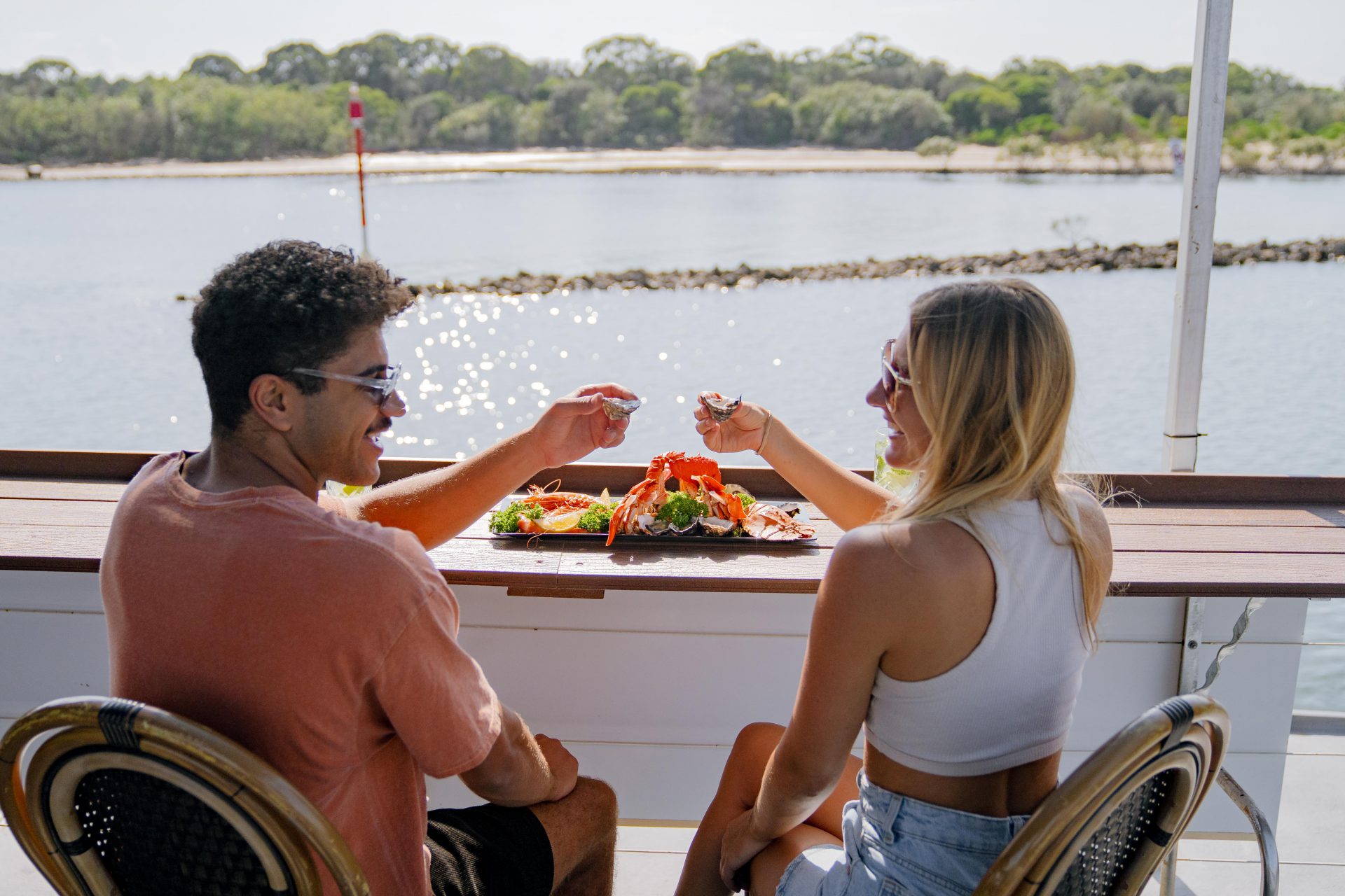 couple enjoying seafood platter on river cruise
