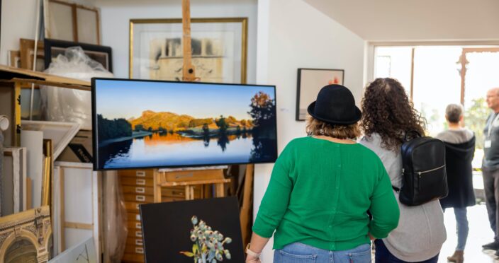 Two ladies admire local artists work at Murwillumbah Art Trail