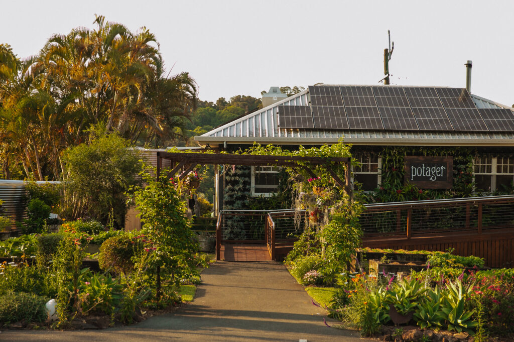 A kitchen garden restaurant with ramp access: The outdoor garden area features lush greenery and accessible pathways, ensuring inclusivity for all patrons.