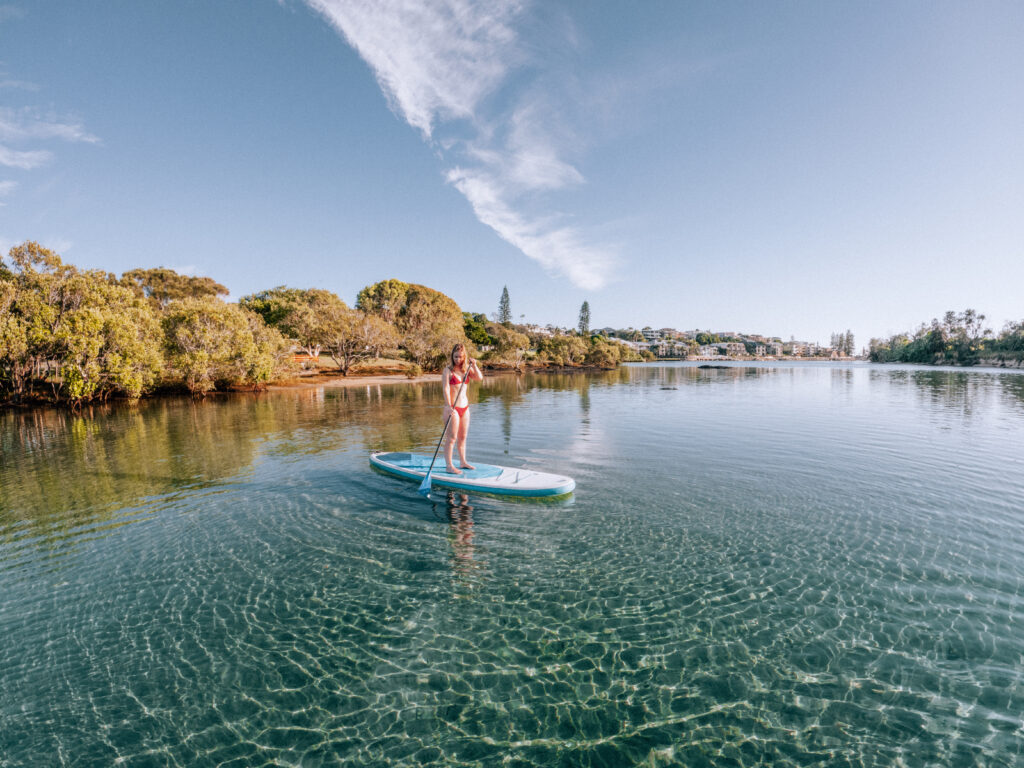 Girl paddleboaridng on cudgen creek