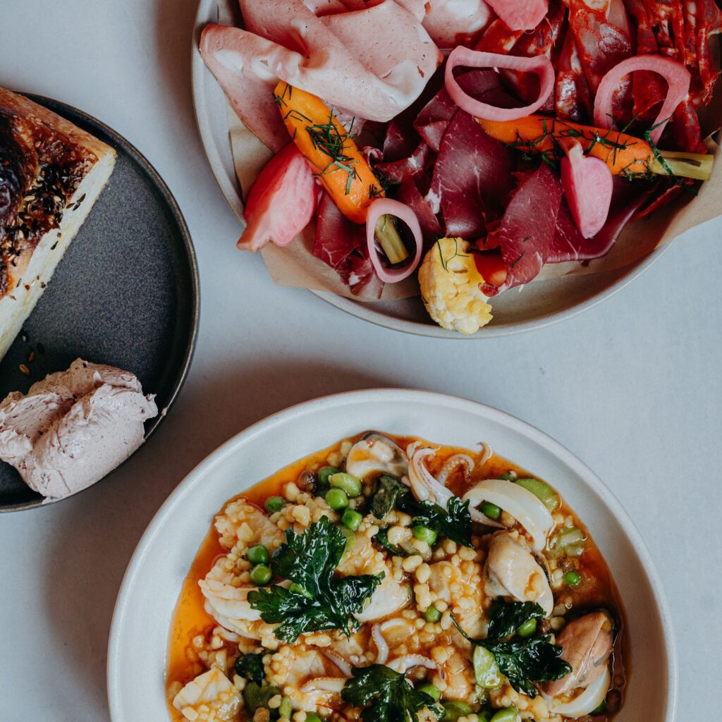 flatlay image of pasta, foccacia and salami at No. 35 Kitchen and Bar