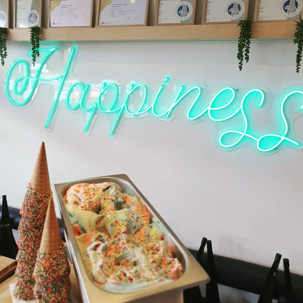 ice cream infront of happiness sign