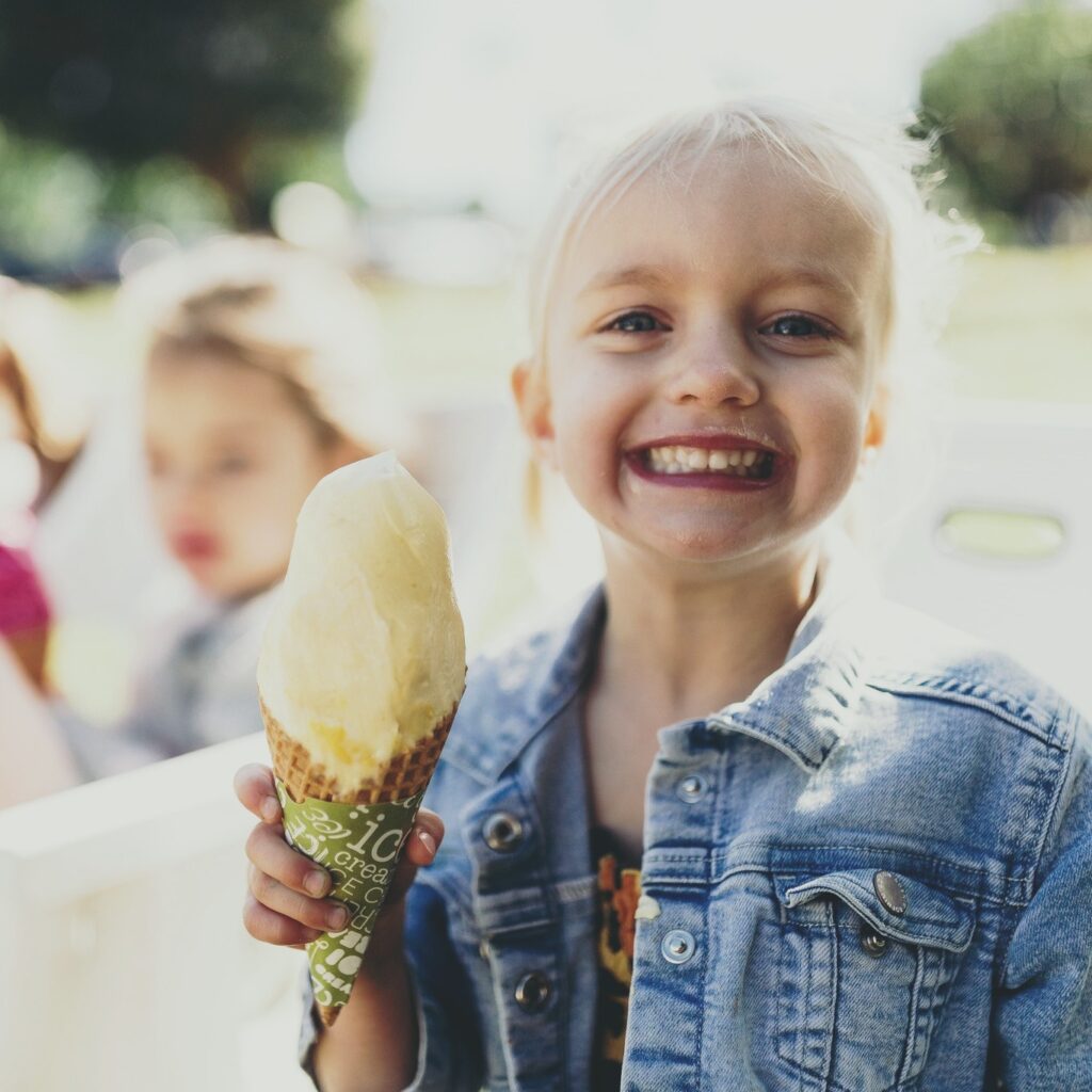 Child with tropical fruit world ice cream